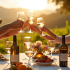 South Africans toasting wine outdoors in a vineyard